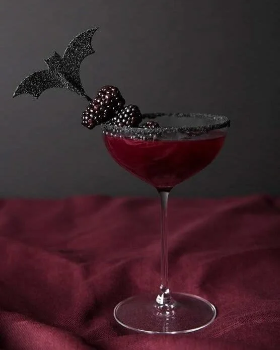 Gothic-themed Halloween cocktail recipes featuring red and black drinks.