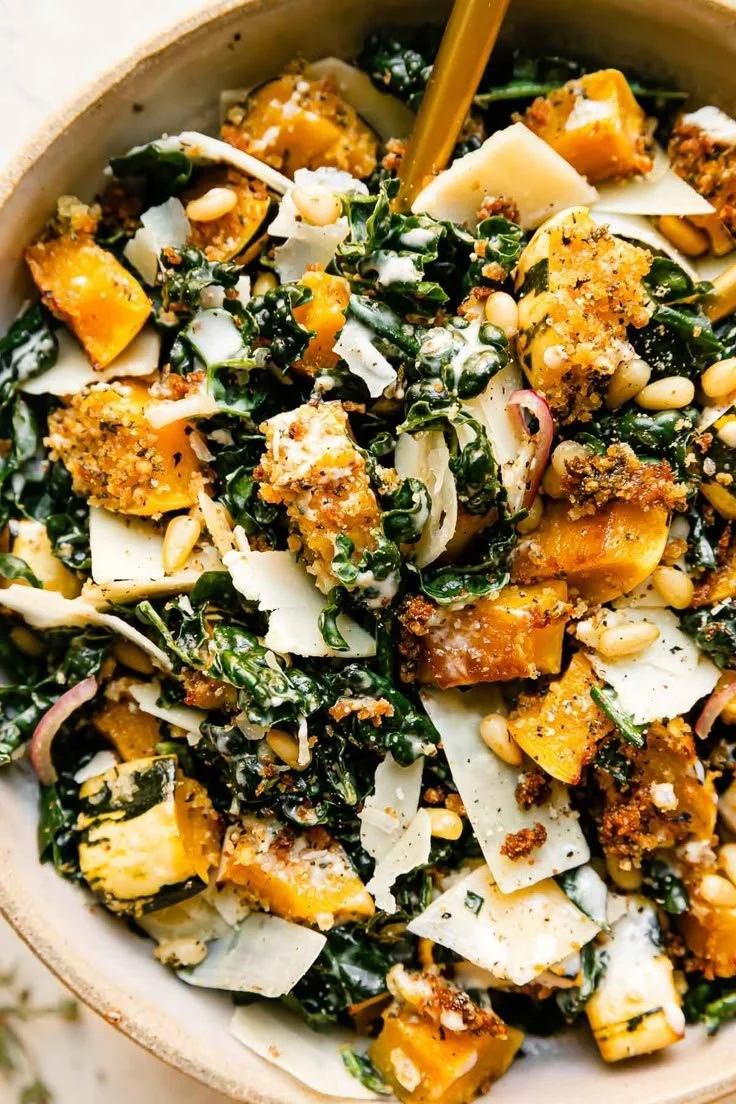Autumn Caesar Salad with delicata squash croutons on a wooden table