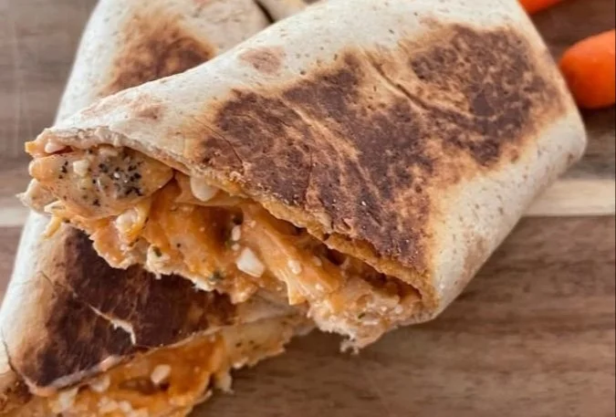 Buffalo Chicken Wrap with 51 grams of protein wrapped in a tortilla