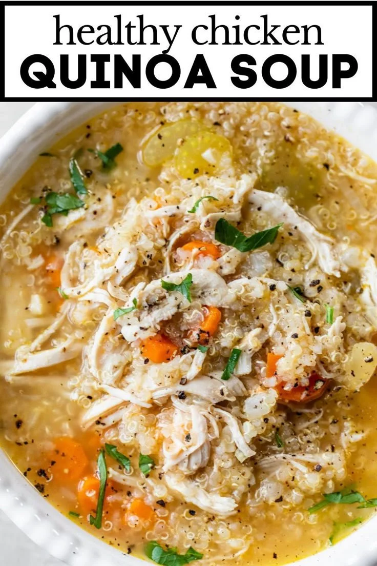 Bowl of chicken quinoa soup with vegetables and herbs