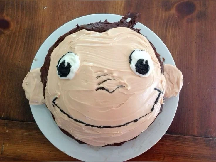Colorful Curious George cake decorated for a birthday party