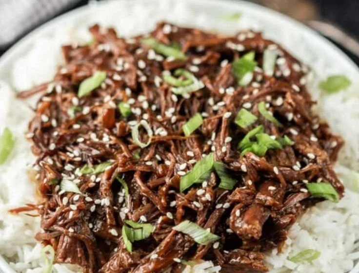 Slow Cooker Korean BBQ Beef served with healthy sides in a bowl