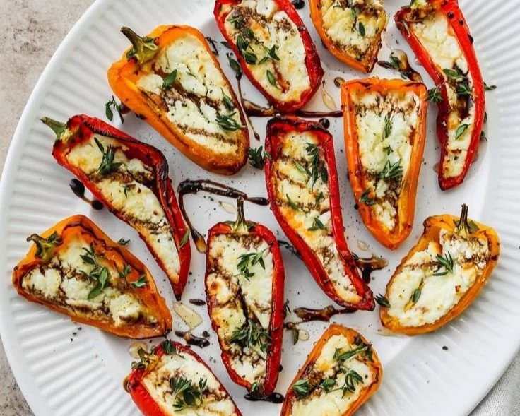 Delicious goat cheese stuffed mini peppers served as an appetizer