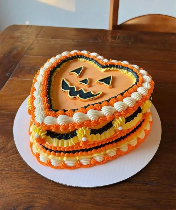 Halloween vintage style cake decorated with spooky elements and elegant design.