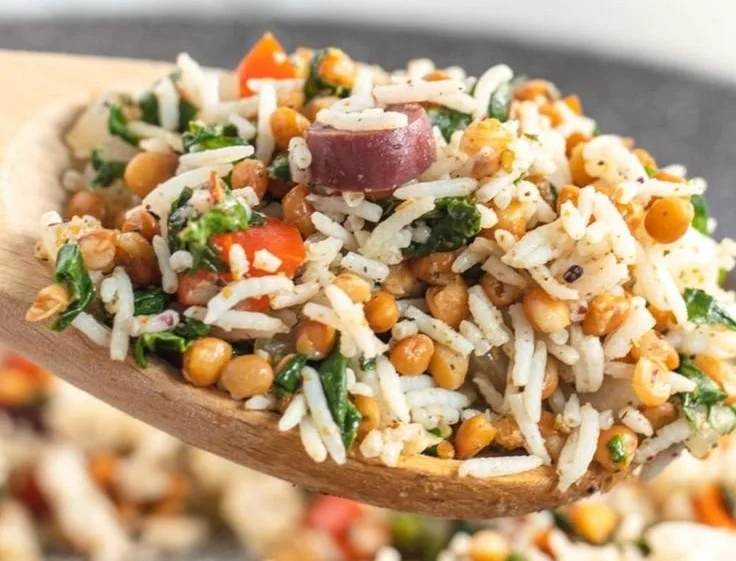Bowl of Mediterranean Rice and Lentils garnished with herbs