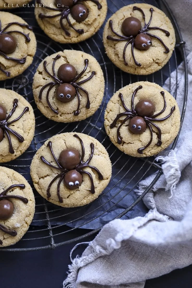 Peanut Butter Spider Cookies decorated with chocolate and candy eyes.
