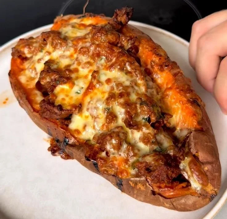 Protein loaded sweet potato boats topped with colorful ingredients